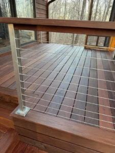 Dark brown wooden Deck after being stained by Alba Pro Services