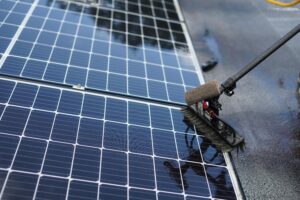 Solar Panel Cleaning with brush and panel-friendly solution.